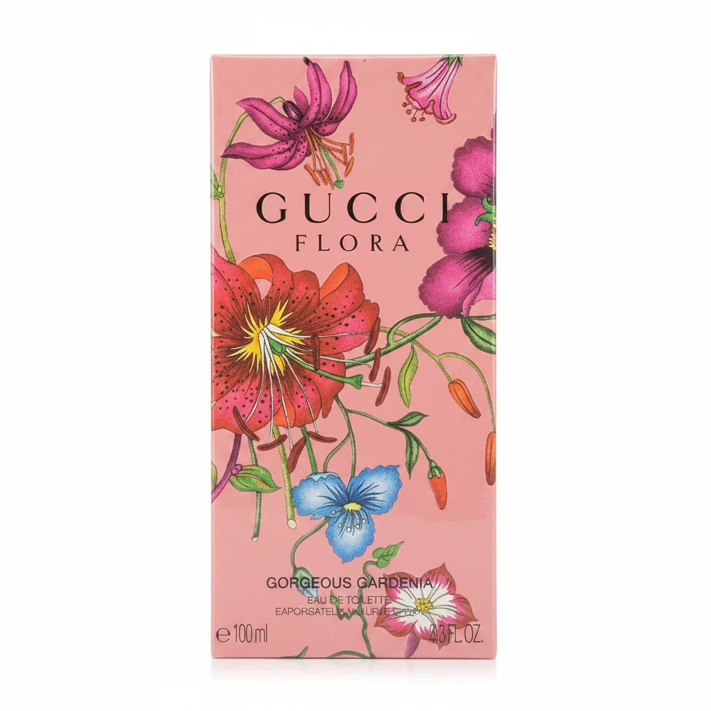 Gucci Flora perfume box with floral design against a wooden background