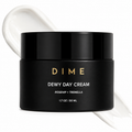 Black jar of DIME Dewy Day Cream with a white cream smear on a white background