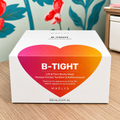 Box of B-Tight lift and firm bootie mask by Maelys on a wooden surface with floral background