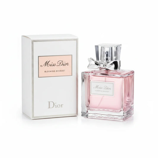 Miss Dior perfume bottle and packaging on a wooden surface