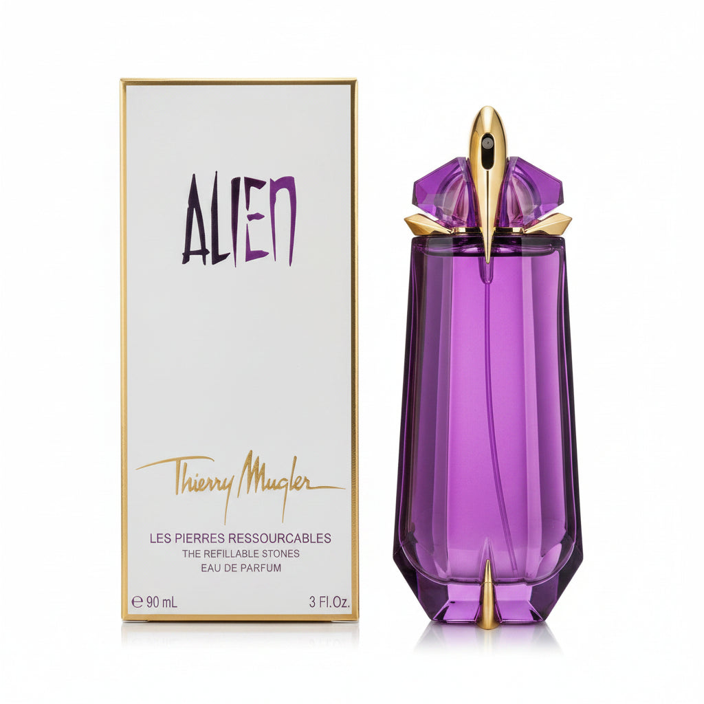 Purple perfume bottle with gold accents next to its packaging on a white background