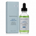 SkinCeuticals Phyto Corrective hydrating soothing fluid in a clear glass dropper bottle next to its light blue packaging box, on a white background.