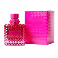 Valentino perfume bottle and packaging with pink design on a white background